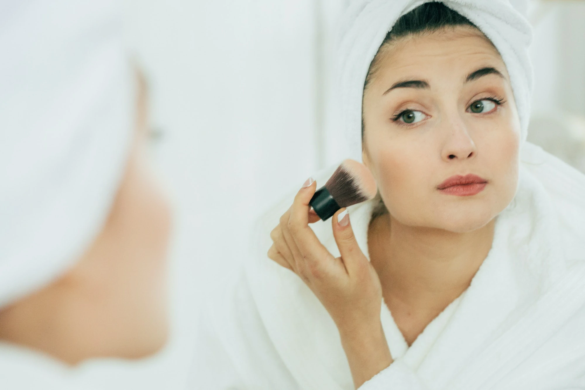 Woman in mirror bathroom making makeup, natural beauty female, beautiful model in bathroom